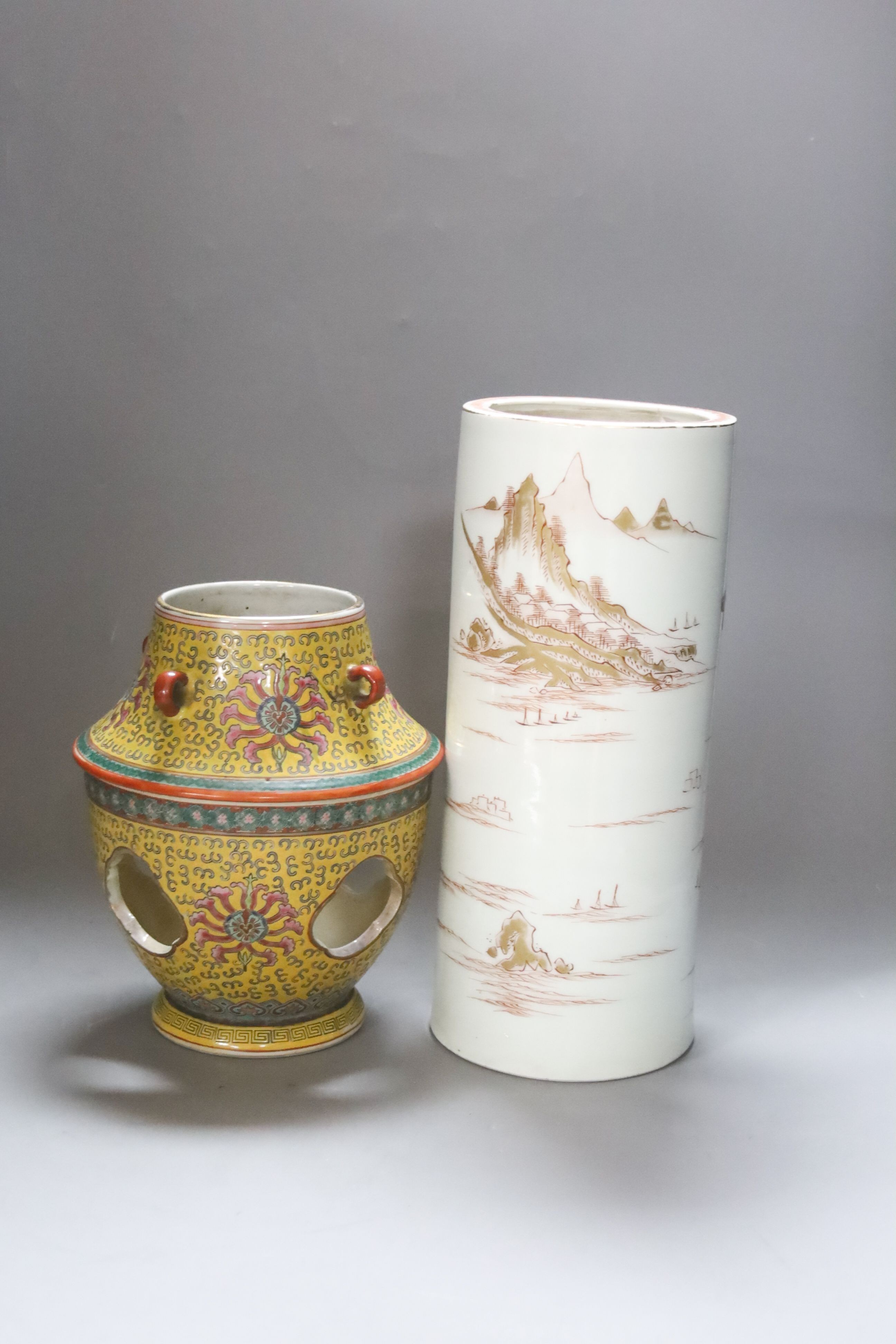 A Japanese porcelain cylindrical vase and a Chinese yellow ground two-section vessel and cover, 29cm